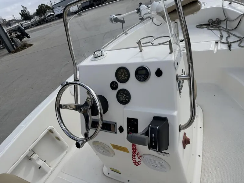 Slide: The Image of 2017 Key West 176cc boat console with steering wheel and gauges. - 11