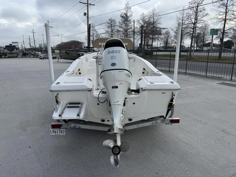 Slide: The Image of 2017 Key West 176cc boat with outboard motor in a parking lot. - 3