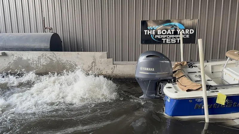 Slide: The Image of 2019 NauticStar 215 XTS boat undergoing performance test with Yamaha engine. - 14