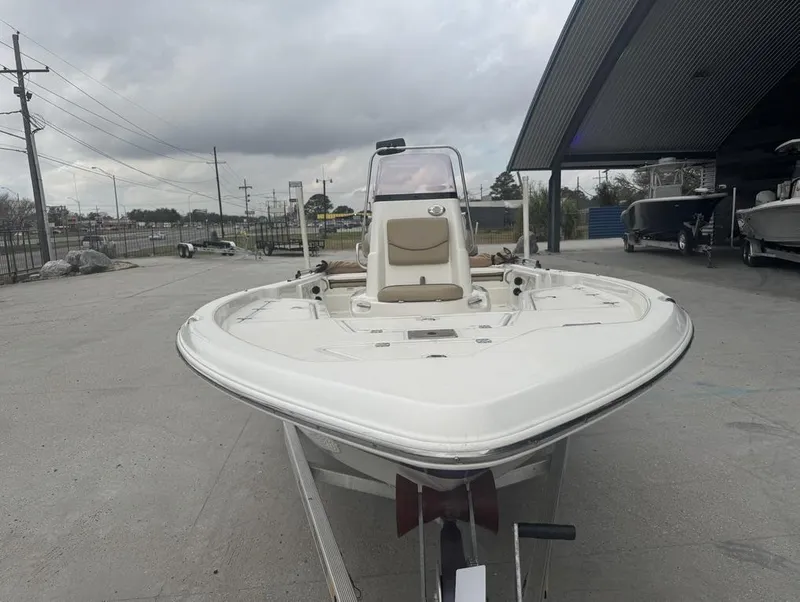Slide: The Image of 2019 NauticStar 215 XTS boat on display at a dealership. - 4