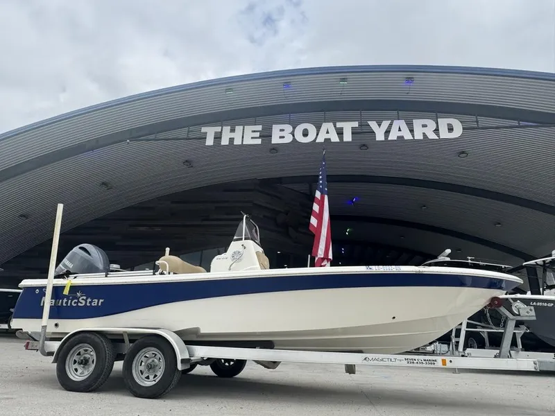 Slide: The Image of 2019 NauticStar 215 XTS boat on trailer at The Boat Yard. - 5