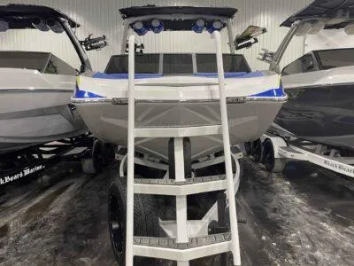 Slide: The Image of 2024 Tigé 24RZX boat on trailer, front view in showroom. - 3