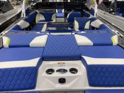 Slide: The Image of 2024 Tigé 24RZX boat interior with blue and white seating, diamond pattern upholstery. - 5