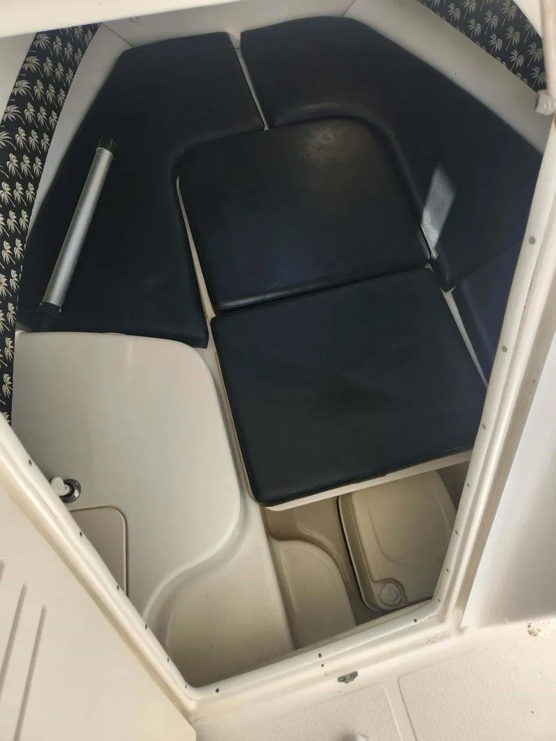 Slide: The Image of Interior cabin of a 2003 Century 2300V boat with cushioned seating. - 4
