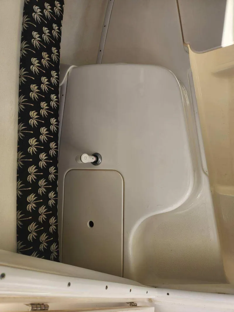 Slide: The Image of Interior of a 2003 Century 2300V boat with palm-patterned fabric. - 7