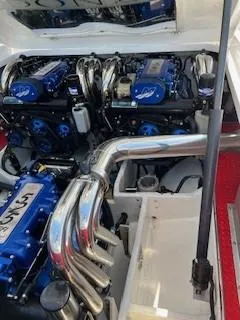 Slide: The Image of Engine compartment of a 2008 Donzi 43 ZR boat, featuring powerful dual engines. - 15