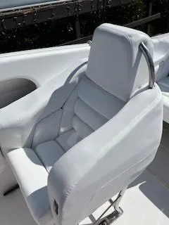 Slide: The Image of 2008 Donzi 43 ZR boat seat with white upholstery and sleek design. - 18