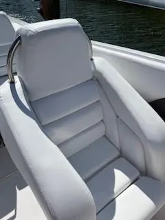 Slide: The Image of 2008 Donzi 43 ZR boat seat, white leather, sleek design, luxury marine interior. - 19