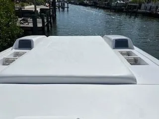 Slide: The Image of 2008 Donzi 43 ZR boat on a calm waterway, showcasing sleek design and luxury features. - 20
