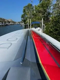 Slide: The Image of 2008 Donzi 43 ZR speedboat on a scenic waterway, featuring sleek design and vibrant colors. - 30
