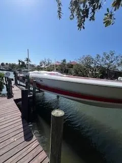 Slide: The Image of 2008 Donzi 43 ZR boat docked on a sunny day by the water. - 35