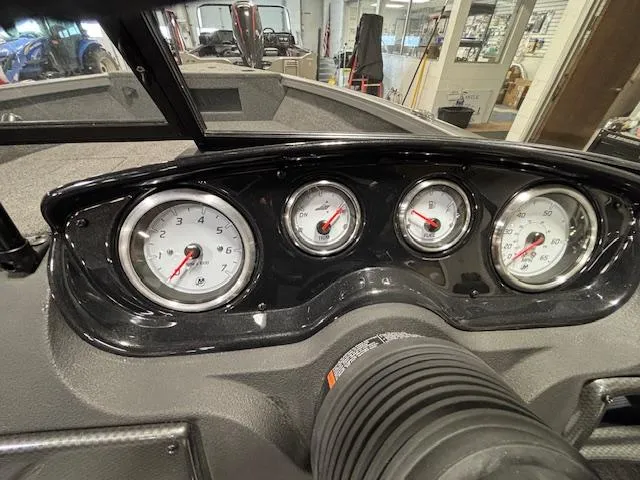 Slide: The Image of Dashboard of 2025 Crestliner 1650 Hawk boat with gauges and controls. - 16