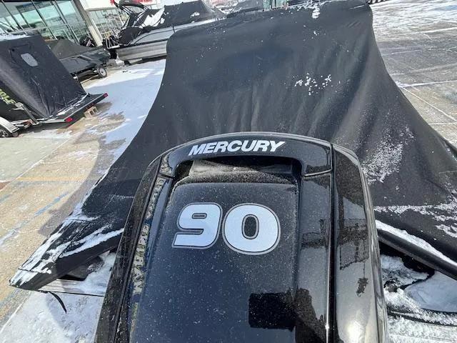 Slide: The Image of 2025 Crestliner 1650 Hawk with Mercury 90 engine, covered in snow. - 23