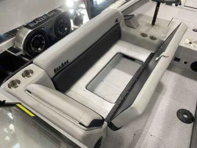 Slide: The Image of 2025 SeaArk EasyCat boat interior with cushioned seating and cup holders. - 11