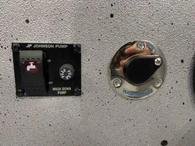 Slide: The Image of Control panel of a 2025 SeaArk EasyCat boat with Johnson pump and washdown switch. - 12