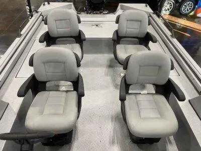 Slide: The Image of 2025 SeaArk EasyCat boat interior with four gray cushioned seats. - 13