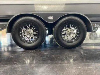 Slide: The Image of 2025 SeaArk EasyCat trailer wheels with stylish alloy rims on a glossy floor. - 6