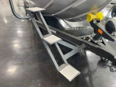 Slide: The Image of Steps on a 2025 SeaArk EasyCat boat trailer, featuring sturdy metal construction. - 7