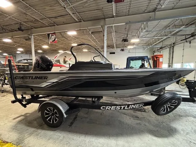 Slide: The Image of 2025 Crestliner 1750 Fish Hawk boat on trailer in indoor showroom. - 0
