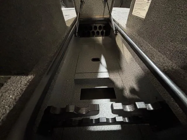 Slide: The Image of Interior storage compartment of 2025 Crestliner 1750 Fish Hawk boat, featuring rod holders. - 12