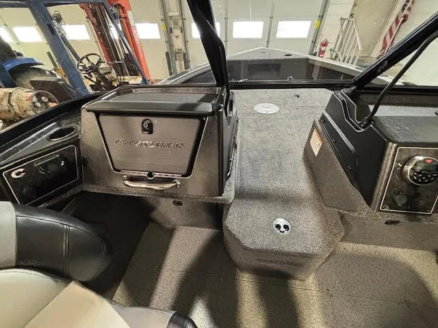 Slide: The Image of 2025 Crestliner 1750 Fish Hawk boat interior with seating and control panel. - 15