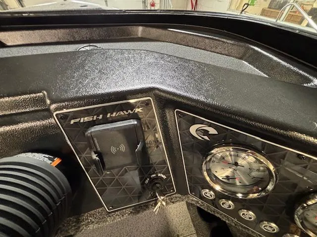 Slide: The Image of Dashboard of 2025 Crestliner 1750 Fish Hawk boat with gauges and controls. - 17