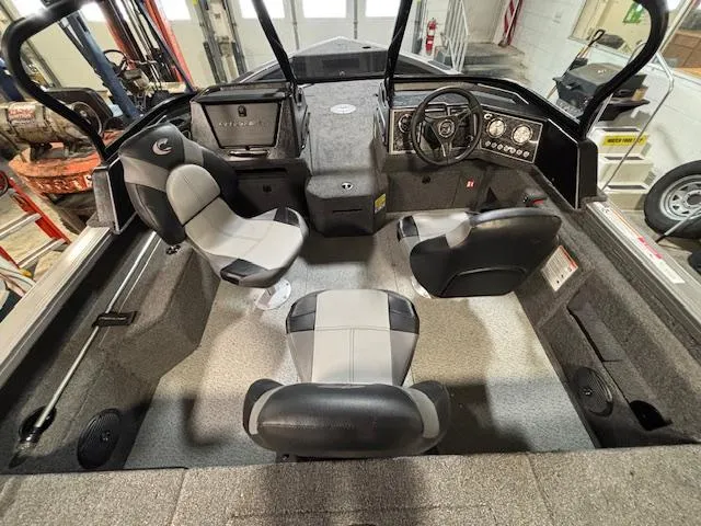 Slide: The Image of 2025 Crestliner 1750 Fish Hawk interior with four seats and modern dashboard. - 21