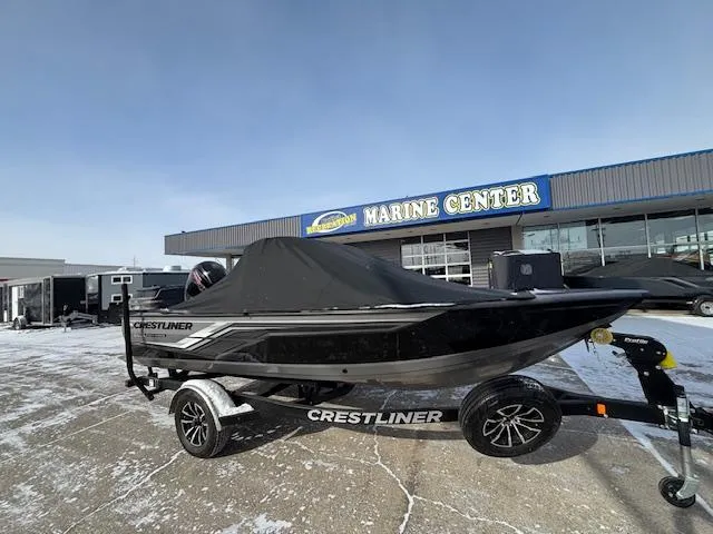 Slide: The Image of 2025 Crestliner 1750 Fish Hawk boat on trailer at marine center. - 24