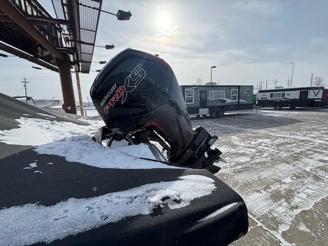 Slide: The Image of 2025 Crestliner 1750 Fish Hawk with Mercury Pro XS engine in snowy outdoor setting. - 26