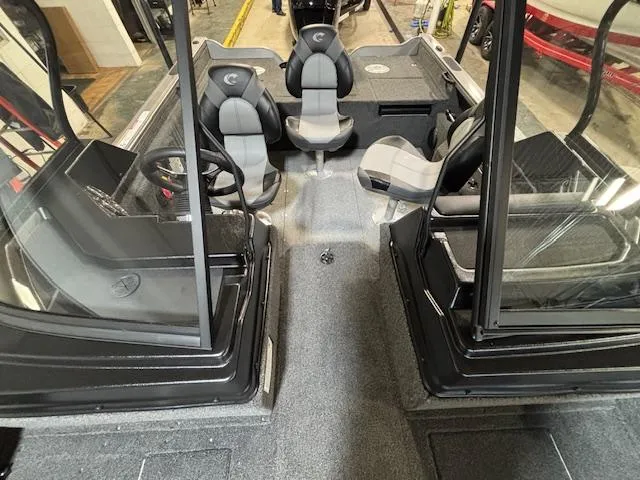 Slide: The Image of 2025 Crestliner 1750 Fish Hawk interior with dual consoles and seating. - 6