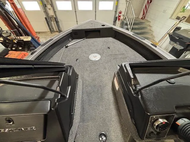 Slide: The Image of 2025 Crestliner 1750 Fish Hawk interior, showcasing spacious deck and storage compartments. - 9