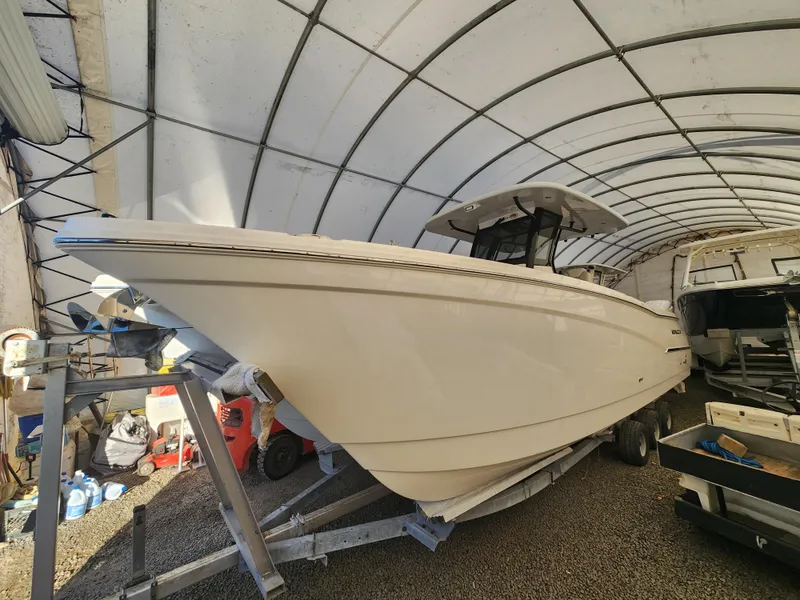 The Image of 2024 World Cat 280 CC-X boat in covered storage, side view. - 0