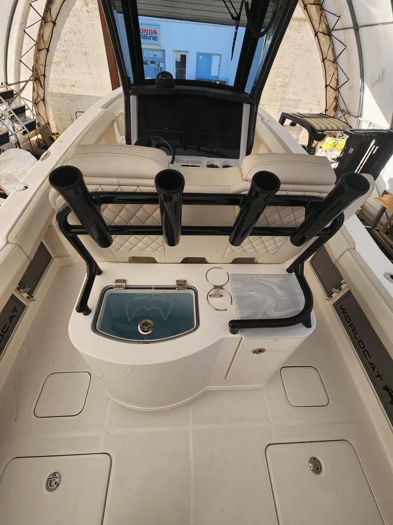 Slide: The Image of 2024 World Cat 280 CC-X boat interior with rod holders and storage compartments. - 3