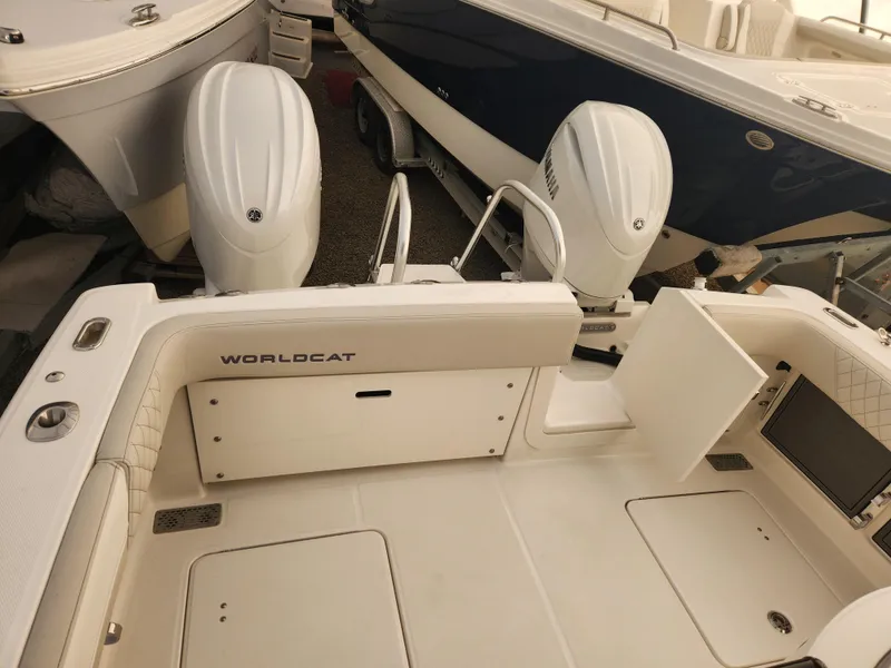 Slide: The Image of 2024 World Cat 280 CC-X boat with dual engines, spacious deck, and sleek design. - 4