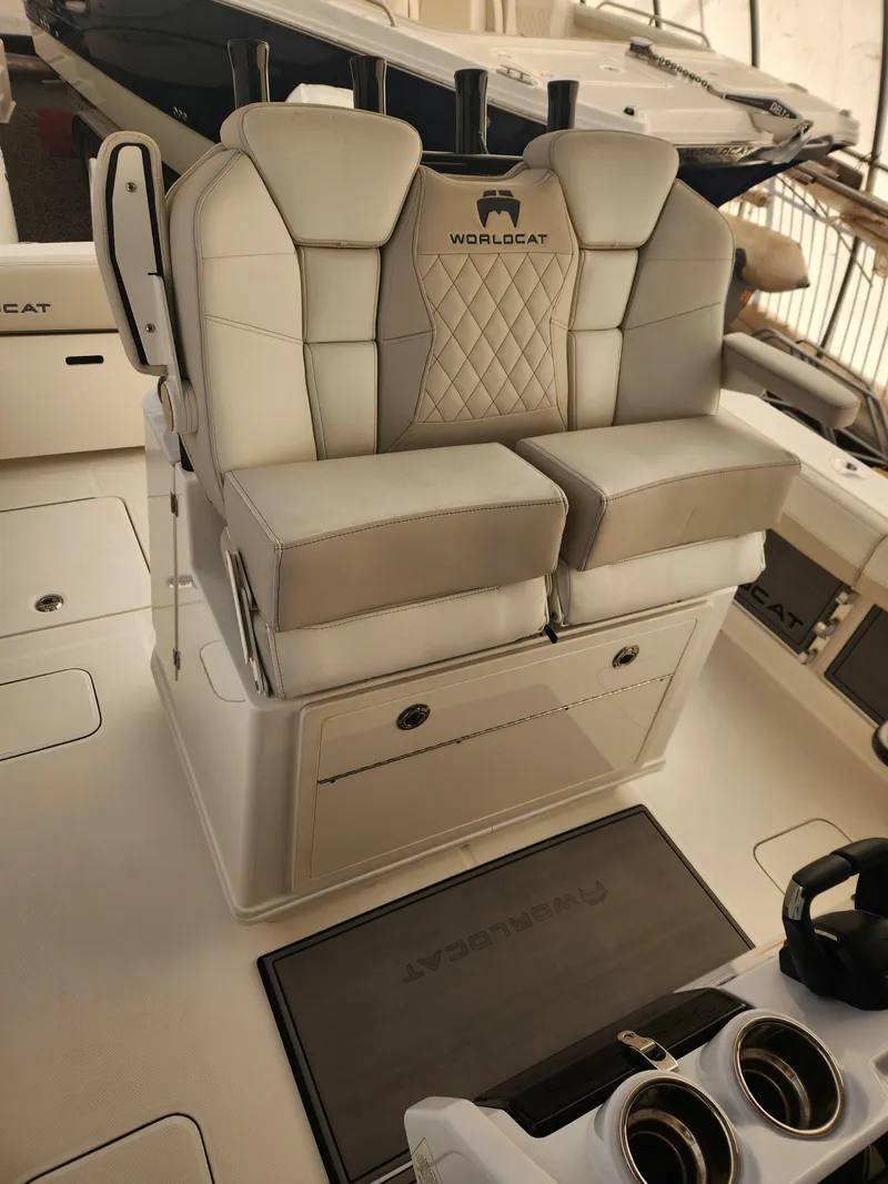 Slide: The Image of 2024 World Cat 280 CC-X boat seating with luxurious upholstery and storage compartments. - 7