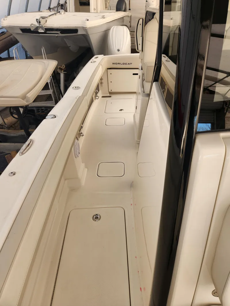 Slide: The Image of 2024 World Cat 280 CC-X boat interior, showcasing sleek design and spacious walkway. - 9