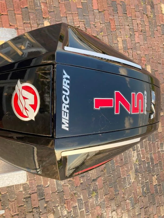 Slide: The Image of 2021 Bennington SX23 with 175HP Mercury engine, top view on brick pavement. - 20