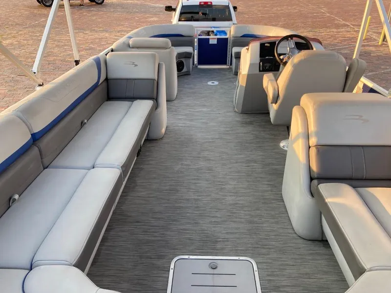 Slide: The Image of 2021 Bennington SX23 boat interior with spacious seating and modern design. - 21