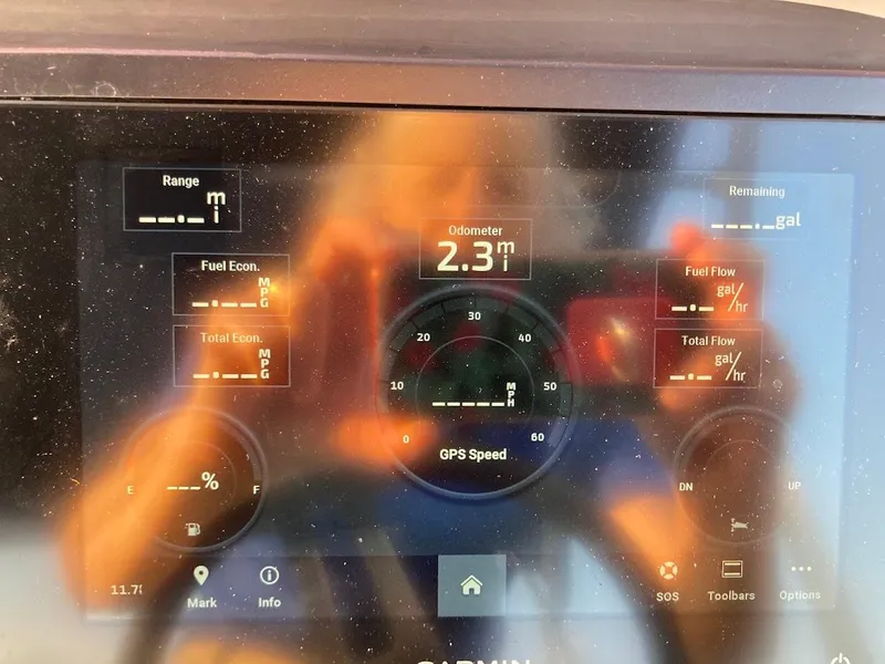 Slide: The Image of Dashboard display of a 2021 Bennington SX23 175HP Mercury boat showing odometer and fuel metrics. - 30