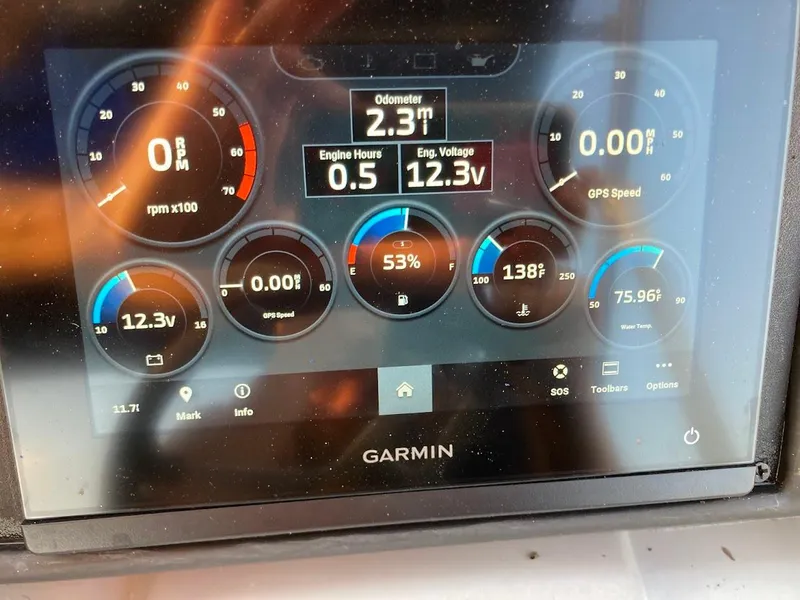 Slide: The Image of Garmin display on 2021 Bennington SX23 boat showing engine metrics and GPS speed. - 31