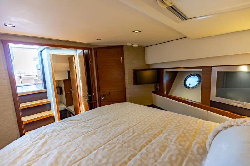 Slide: The Image of Luxurious bedroom interior of 2015 Tiara Yachts 44 Coupe with modern amenities. - 12