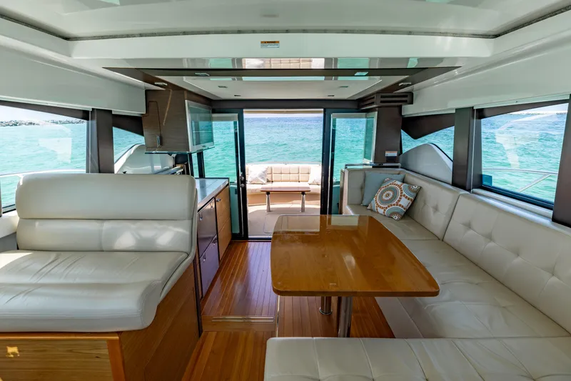 Slide: The Image of Interior of 2015 Tiara Yachts 44 Coupe with elegant seating and ocean view. - 7