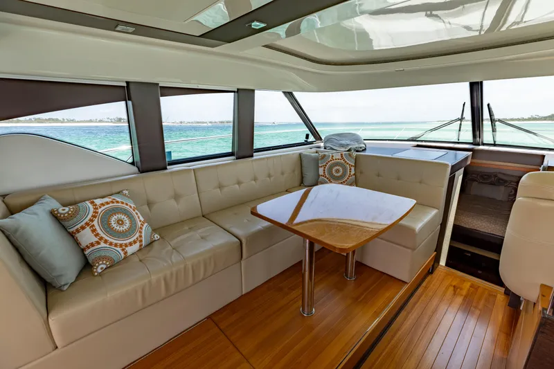 Slide: The Image of Luxurious interior of 2015 Tiara Yachts 44 Coupe with elegant seating and ocean view. - 8