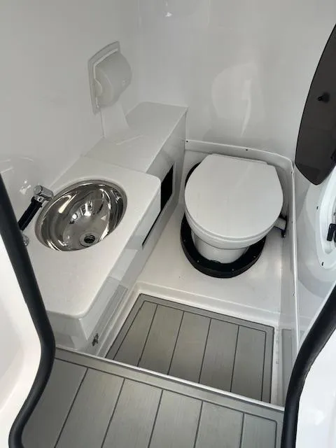 Slide: The Image of Open storage compartment on 2024 Blackfin 302 DC boat, showing interior details. - 12