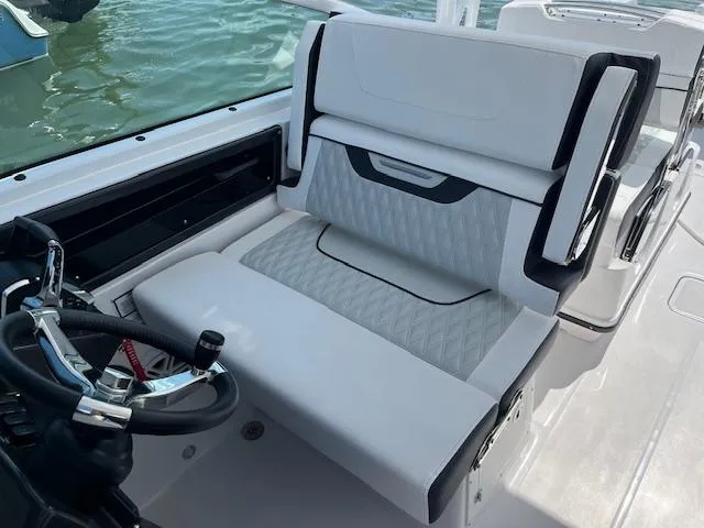 Slide: The Image of 2024 Blackfin 302 DC boat interior with luxurious seating and modern design. - 20