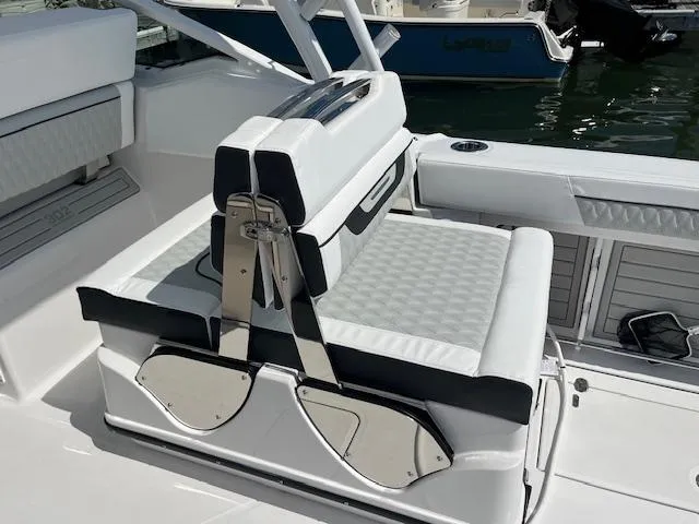 Slide: The Image of 2024 Blackfin 302 DC boat with Garmin and FLIR equipment at a marina. - 23