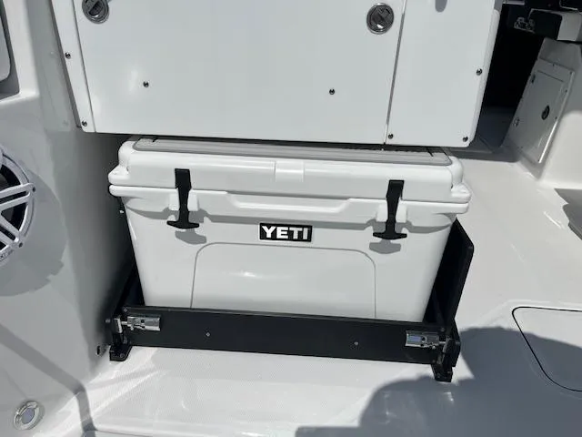 Slide: The Image of 2024 Blackfin 302 DC boat interior storage compartment with open sliding drawers. - 30