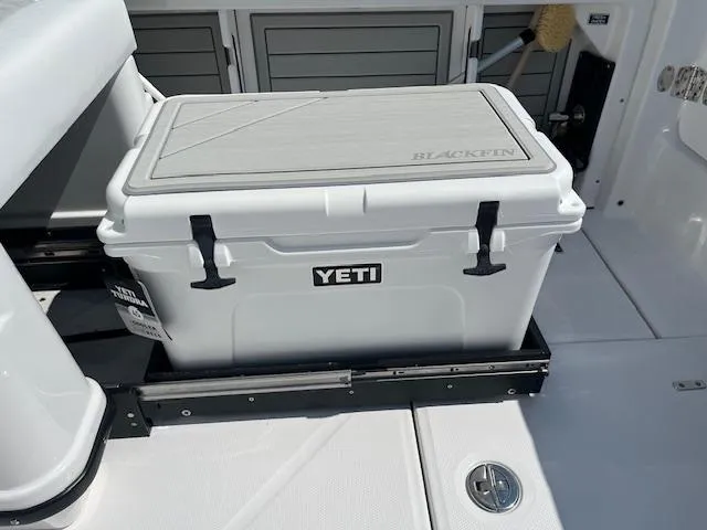 Slide: The Image of 2024 Blackfin 302 DC boat storage compartment with hydraulic struts and wiring. - 5