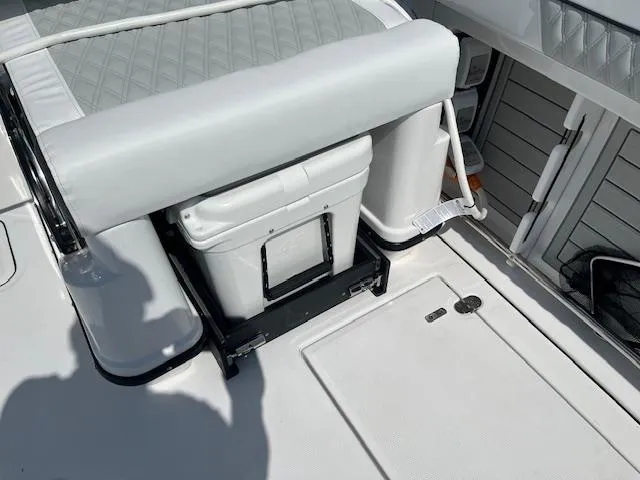 Slide: The Image of YETI cooler on 2024 Blackfin 302 DC boat deck, featuring secure mounting. - 6