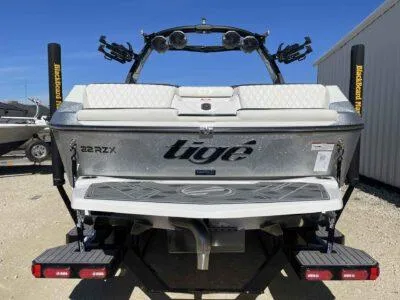 Slide: The Image of 2024 Tigé 22RZX boat rear view, showcasing sleek design and modern features. - 4